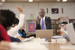 Librarian helping students in school library