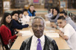 Librarian with students in school library