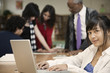 Student with laptop in school library