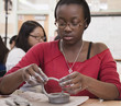 African American student working with clay in classroom