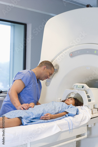 Photo: Doctor preparing patient for MRI Doctor preparing patient for MRI
