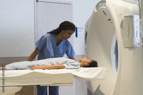 Photo: Doctor preparing patient for MRI Doctor preparing patient for MRI