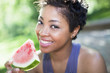 Black woman eating watermelon