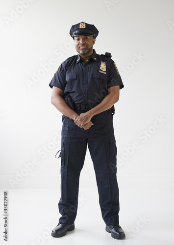 Photo: African American policeman with hands clasped African American policeman with hands clasped