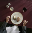 Caucasian woman preparing to eat meat and potatoes