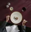 Caucasian woman about to eat tiny portion of meat and potatoes