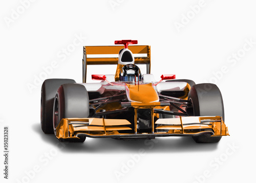 Photo: Orange race car with driver Orange race car with driver
