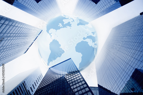 Photo: Large blue globe over highrise buildings Large blue globe over highrise buildings