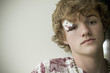Photo: Caucasian teenager with black eye and bandage Caucasian teenager with black eye and bandage