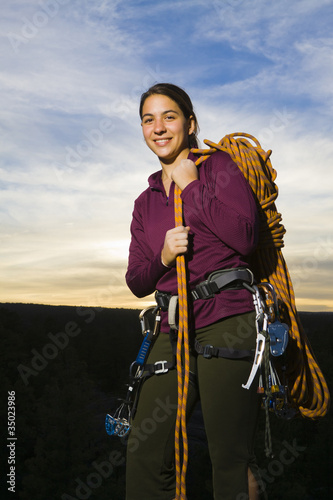 Photo: Caucasian woman preparing for rock climbing Caucasian woman preparing for rock climbing