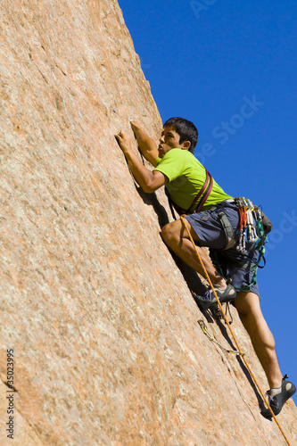 Photo: Hispanic man rock climbing Hispanic man rock climbing
