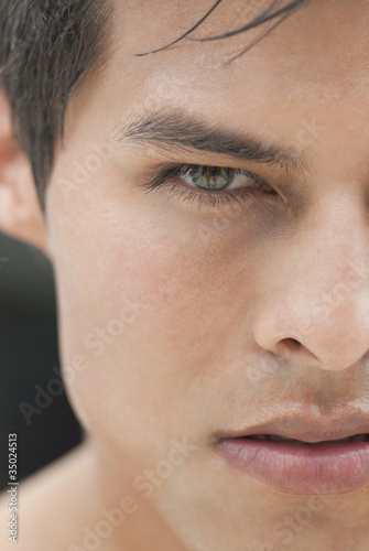 Photo: Close up of angry Hispanic man Close up of angry Hispanic man