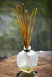 Sticks of incense in glass jar