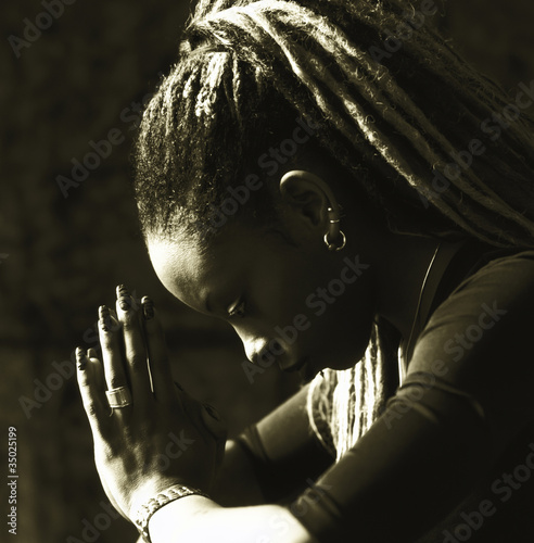 Photo: Serious woman praying Serious woman praying