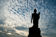 Standing buddha image on beautiful blue sky Standing buddha image on beautiful blue sky