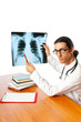 Male doctor looking at x-ray image