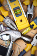 Set of tools over a wood panel