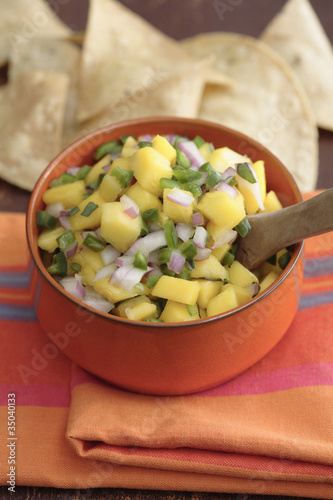 Photo: Close up of mango salsa and tortilla chips Close up of mango salsa and tortilla chips