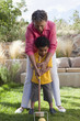 Grandmother and grandson playing croquet