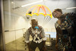 African American business people looking at golden parachute drawing