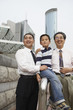 "Chinese grandfather, father and son together outdoors"