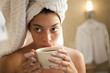 Mixed race woman drinking coffee in the morning