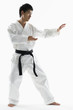 Photo: Asian male black belt practicing karate Asian male black belt practicing karate