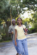 Black grandfather going fishing with granddaughter