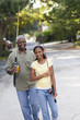 Black grandfather going fishing with granddaughter