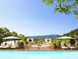 Photo: "Swimming pool with striped chaise lounge chairs and umbrellas at a luxury resort overlooking Napa Valley, California" "Swimming pool with striped chaise lounge chairs and umbrellas at a luxury resort overlooking Napa Valley, California"