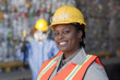 Black sanitation worker working in recycling plant