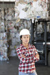 Hispanic sanitation worker working in recycling plant