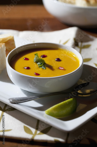 Photo: Curry soup in bowl with garnish Curry soup in bowl with garnish