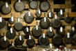 Array of saute and frying pans hanging on wall