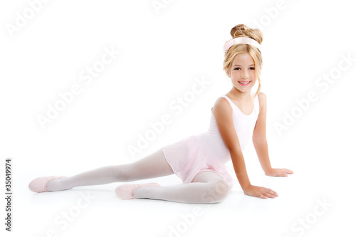 Photo: Ballerina little ballet children dancer stretching sitting Ballerina little ballet children dancer stretching sitting