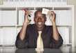 African American businessman holding dollar sign