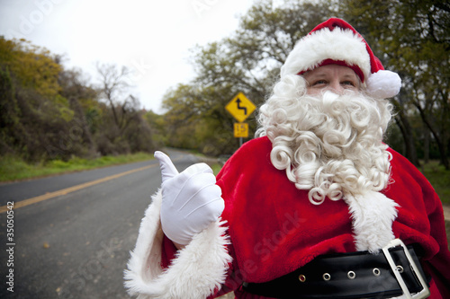 Photo: Santa hitchhiking at roadside Santa hitchhiking at roadside