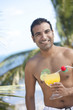Hispanic man drinking cocktail