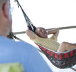 Caucasian man laying in hammock