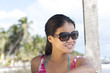 Smiling Chinese woman wearing sunglasses