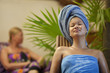 Chinese woman relaxing with towel on her head