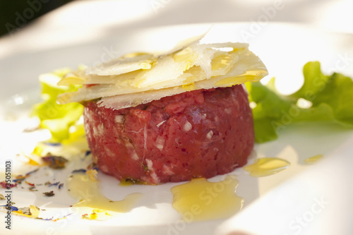 Photo: Parmesan cheese atop steak tartare Parmesan cheese atop steak tartare