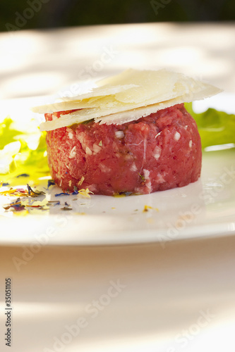 Photo: Parmesan cheese atop steak tartare Parmesan cheese atop steak tartare
