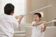 Korean brothers playing with swords