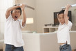 Korean brothers playing with swords