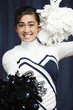 Filipino cheerleader with pompoms in uniform