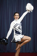 Filipino cheerleader with pompoms in uniform