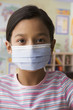 Hispanic girl wearing surgical mask