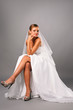attractive bride sitting on studio