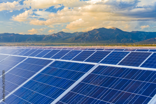 Photo: Mountains behind solar panels Mountains behind solar panels